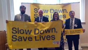 LCC Councillors and SPC Councillor Hampson stand behind a Slow Down Save Lives banner at the initiative's launch in November 21.